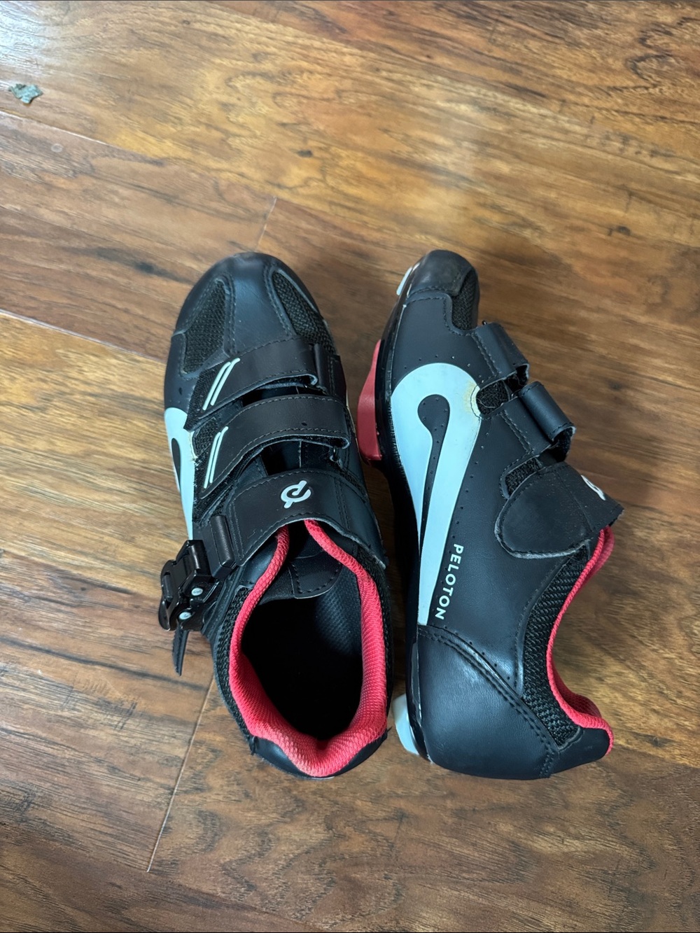 Peloton Black Cycling Shoes with Light Blue Swoosh and Red Lining
